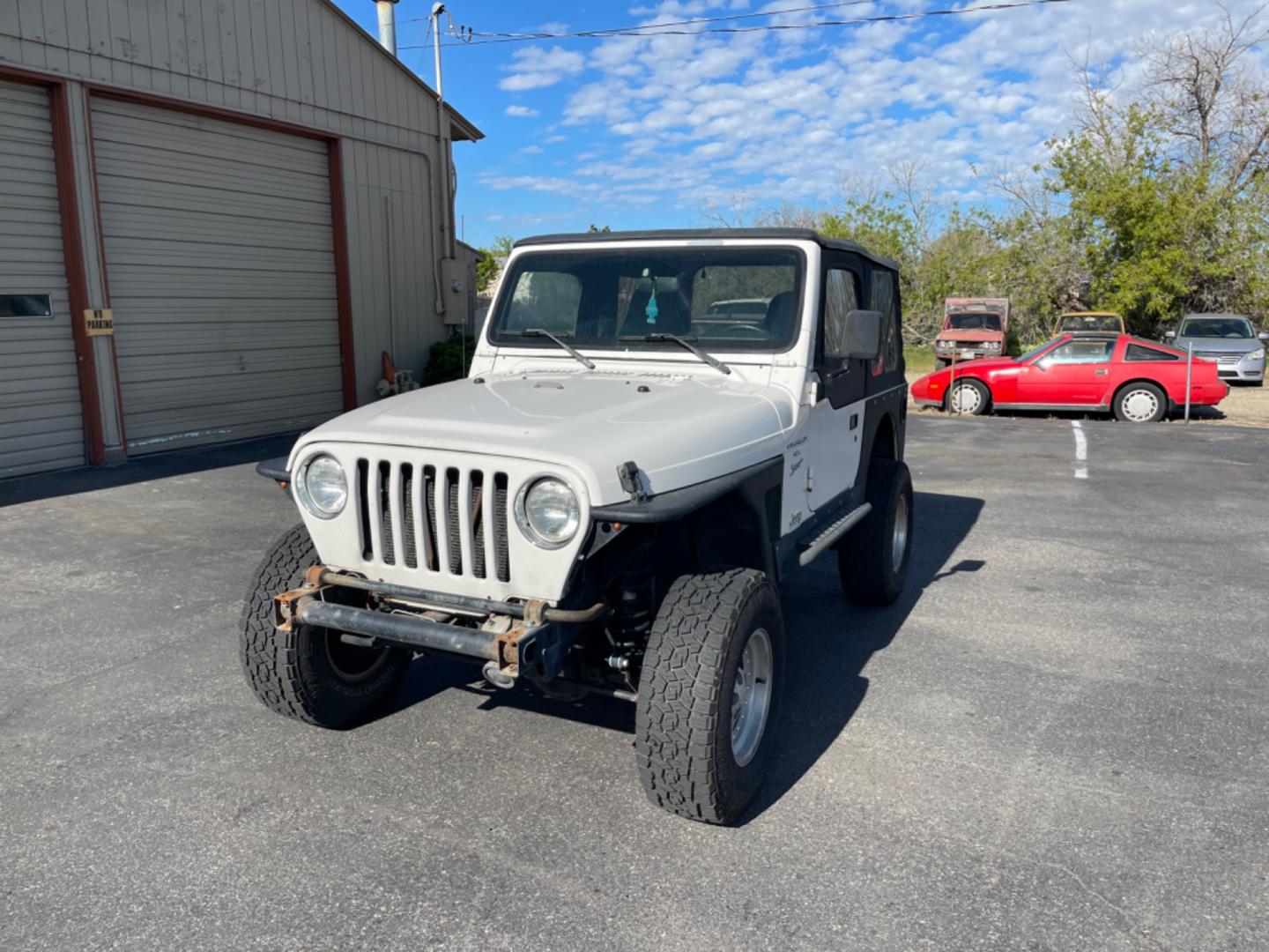 1997 Jeep Wrangler Sport (1J4FY19S4VP) with an 4.0L L6 OHV 12V engine, 5spd Manual transmission, located at 813 E Fairview Ave, Meridian , ID, 83642, (208) 336-8230, 43.618851, -116.384010 - Photo#2